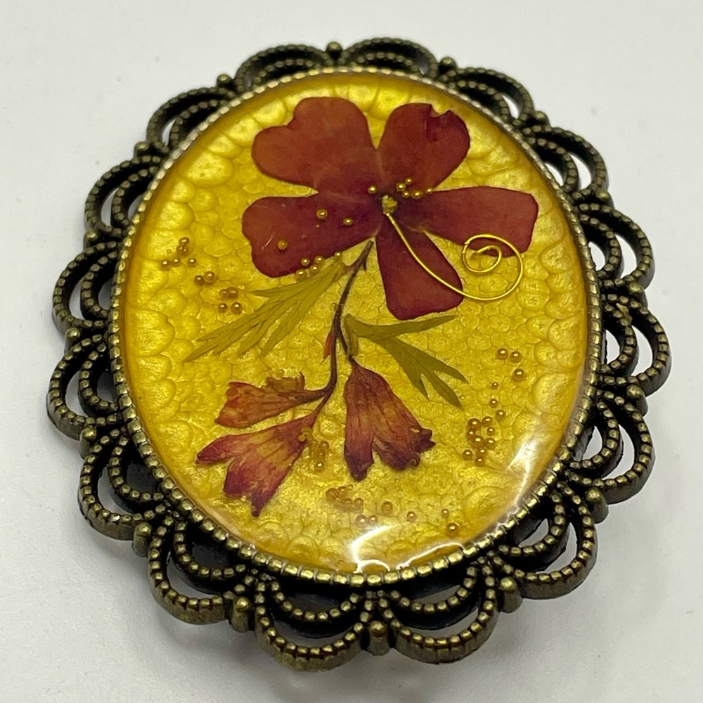 Vintage Pressed Flower in Resin Brooch with a Decorative Frame. Red and Gold